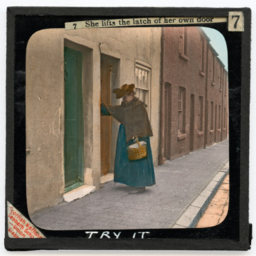 7. She lifts the latch of her own door